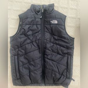 Boys North Face reversible black/plaid puffy vest.